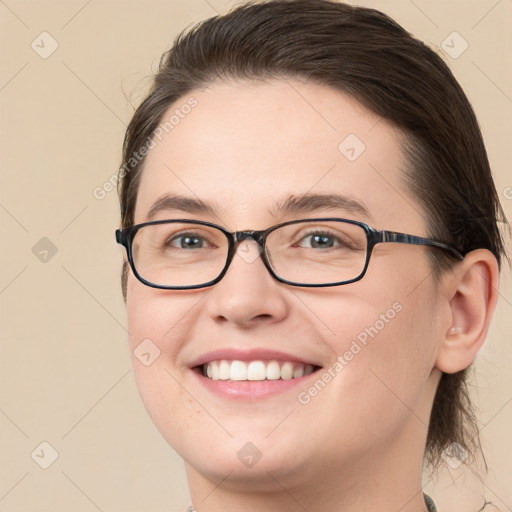 Joyful white young-adult female with medium  brown hair and brown eyes