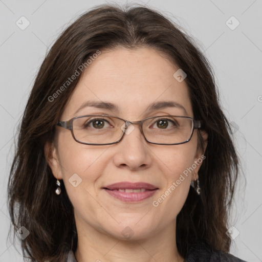 Joyful white adult female with medium  brown hair and grey eyes