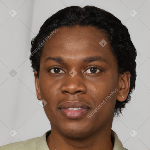 Joyful black young-adult male with short  black hair and brown eyes