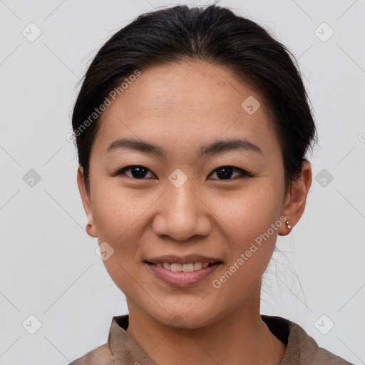 Joyful asian young-adult female with short  brown hair and brown eyes