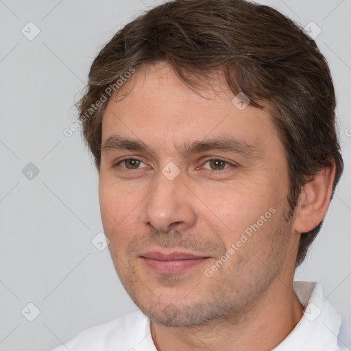 Joyful white adult male with short  brown hair and brown eyes