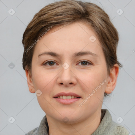 Joyful white young-adult female with short  brown hair and grey eyes