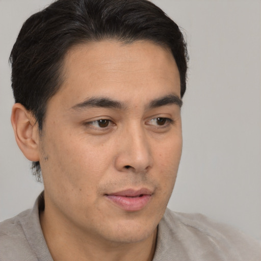 Neutral latino young-adult male with short  brown hair and brown eyes