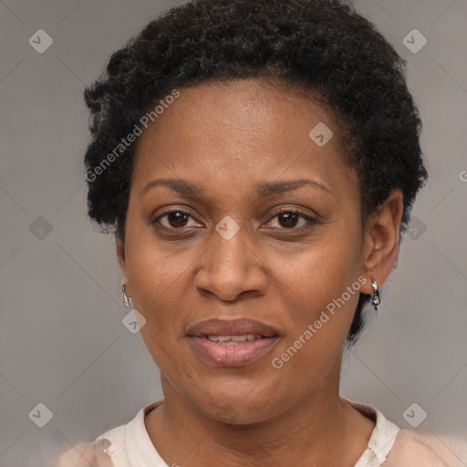 Joyful black adult female with short  brown hair and brown eyes