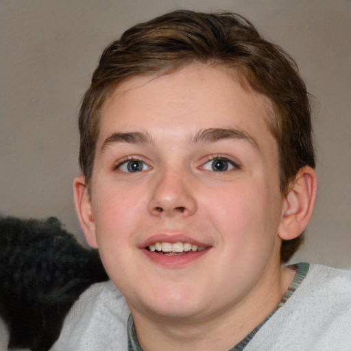 Joyful white young-adult male with short  brown hair and blue eyes