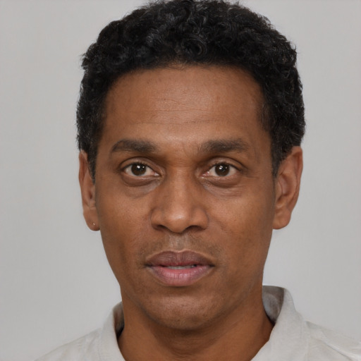 Neutral latino adult male with short  black hair and brown eyes