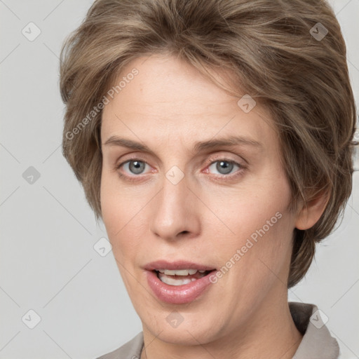 Joyful white adult female with medium  brown hair and grey eyes