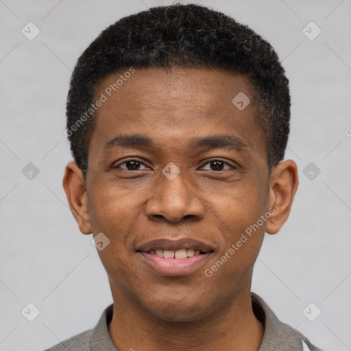 Joyful black young-adult male with short  brown hair and brown eyes