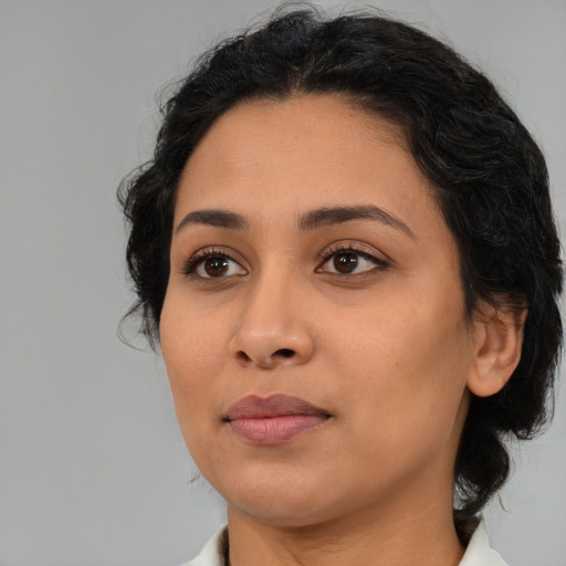 Neutral latino young-adult female with medium  black hair and brown eyes