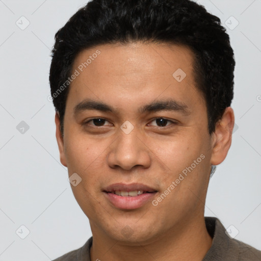 Joyful asian young-adult male with short  brown hair and brown eyes