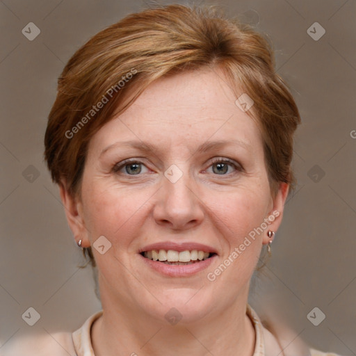 Joyful white adult female with medium  brown hair and grey eyes