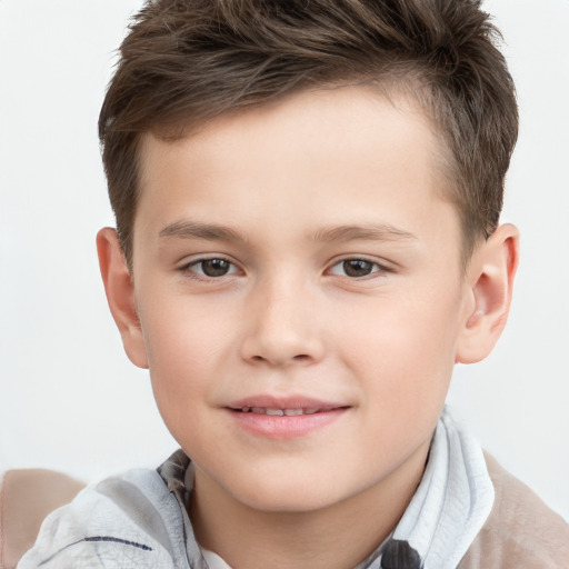 Joyful white child male with short  brown hair and brown eyes