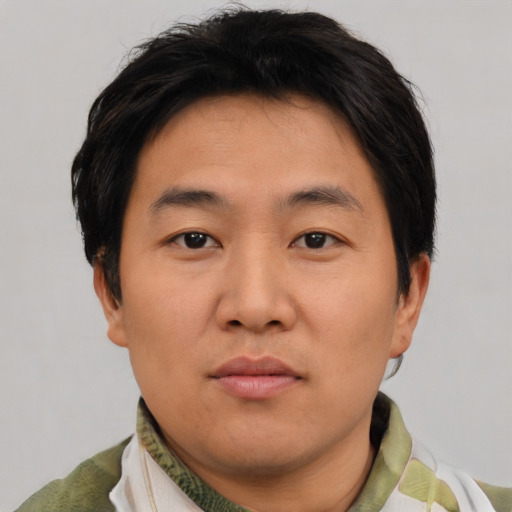 Neutral asian young-adult male with short  brown hair and brown eyes