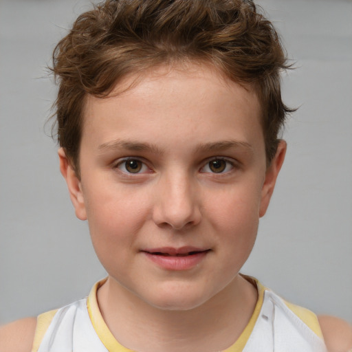 Joyful white child male with short  brown hair and brown eyes