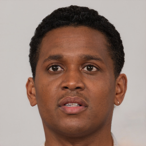 Neutral black young-adult male with short  brown hair and brown eyes