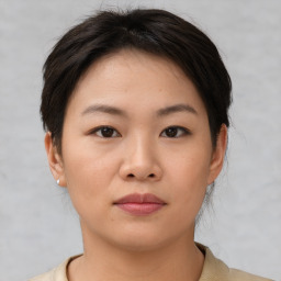 Neutral asian young-adult female with short  brown hair and brown eyes