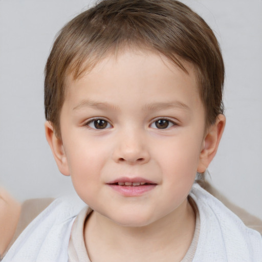 Joyful white child male with short  brown hair and brown eyes