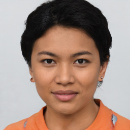 Joyful asian young-adult female with short  black hair and brown eyes