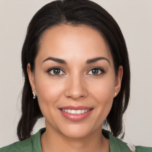 Joyful white young-adult female with medium  brown hair and brown eyes