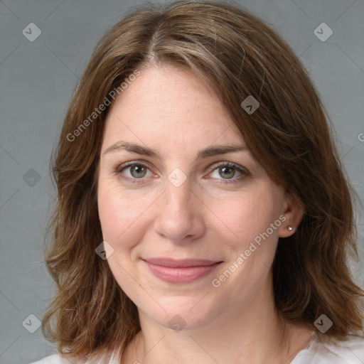 Joyful white young-adult female with medium  brown hair and green eyes