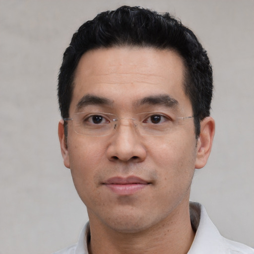Neutral asian adult male with short  black hair and brown eyes