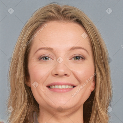 Joyful white young-adult female with long  brown hair and blue eyes