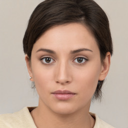 Neutral white young-adult female with medium  brown hair and brown eyes