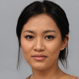 Joyful asian young-adult female with medium  black hair and brown eyes