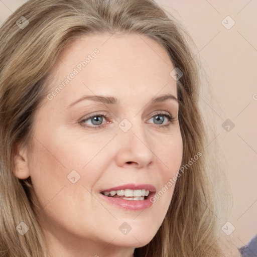 Joyful white young-adult female with long  brown hair and blue eyes