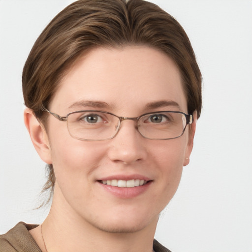 Joyful white young-adult female with short  brown hair and blue eyes