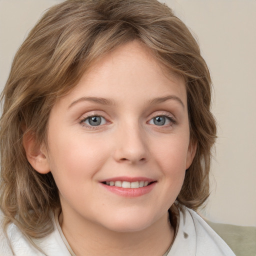 Joyful white child female with medium  brown hair and grey eyes