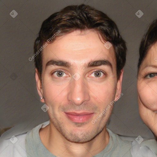 Joyful white adult male with short  brown hair and brown eyes