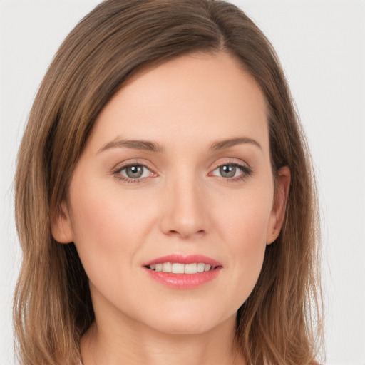 Joyful white young-adult female with long  brown hair and grey eyes