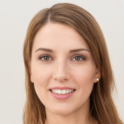 Joyful white young-adult female with long  brown hair and green eyes