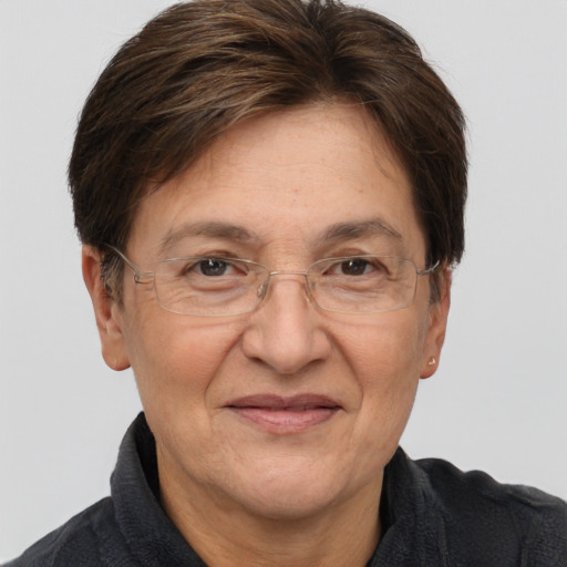 Joyful white middle-aged female with short  brown hair and brown eyes