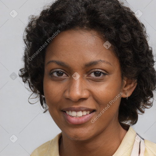 Joyful black young-adult female with long  brown hair and brown eyes