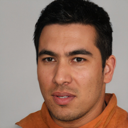 Joyful white young-adult male with short  black hair and brown eyes