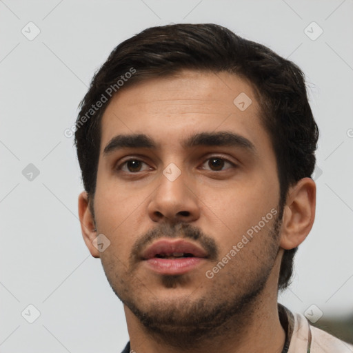 Neutral white young-adult male with short  black hair and brown eyes