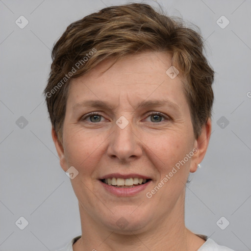 Joyful white adult female with short  brown hair and grey eyes