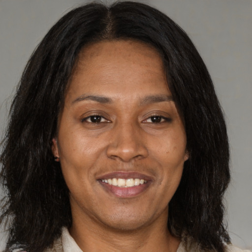 Joyful asian adult female with medium  brown hair and brown eyes