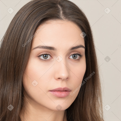 Neutral white young-adult female with long  brown hair and brown eyes