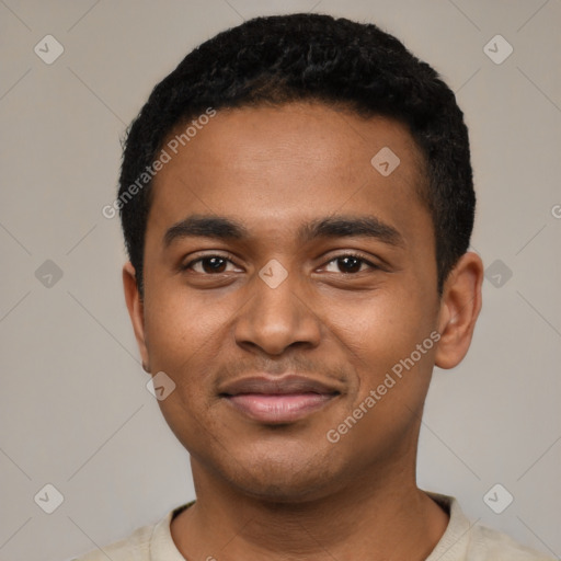 Joyful black young-adult male with short  black hair and brown eyes