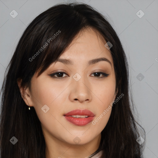 Joyful asian young-adult female with long  brown hair and brown eyes