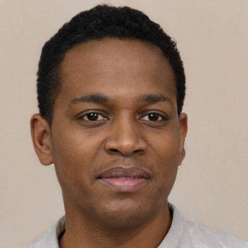 Neutral black young-adult male with short  black hair and brown eyes