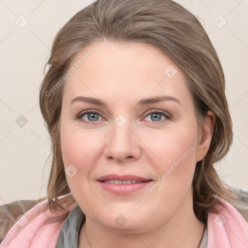 Joyful white young-adult female with medium  brown hair and blue eyes