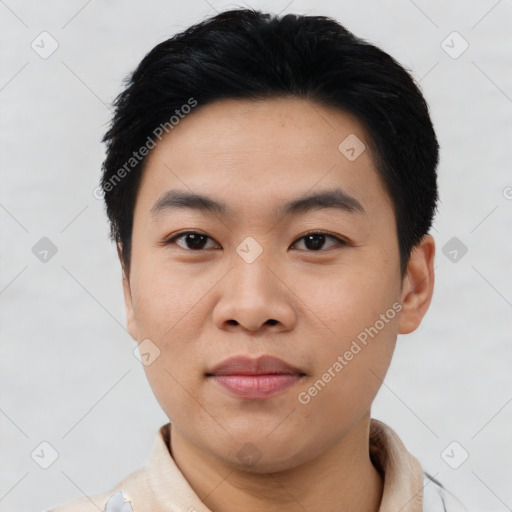 Joyful asian young-adult male with short  black hair and brown eyes