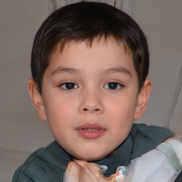 Joyful white child male with short  brown hair and brown eyes