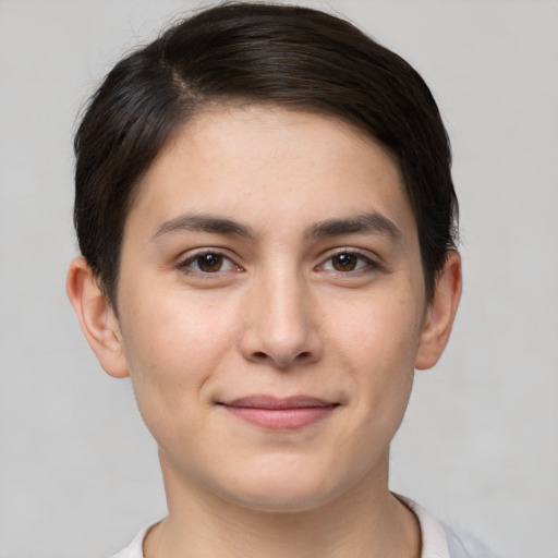 Joyful white young-adult female with short  brown hair and brown eyes