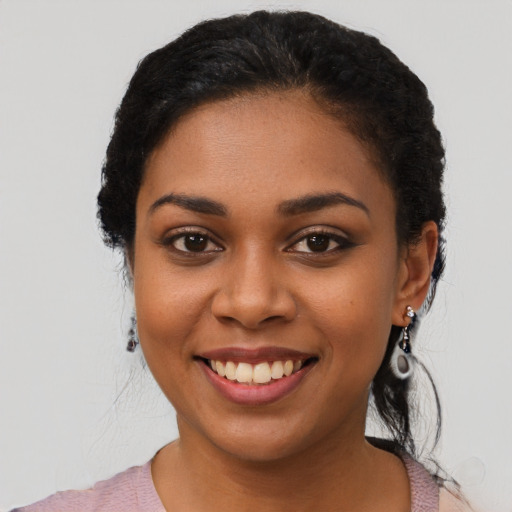 Joyful latino young-adult female with long  black hair and brown eyes