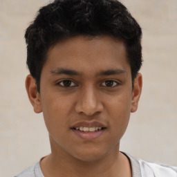 Joyful latino young-adult male with short  brown hair and brown eyes